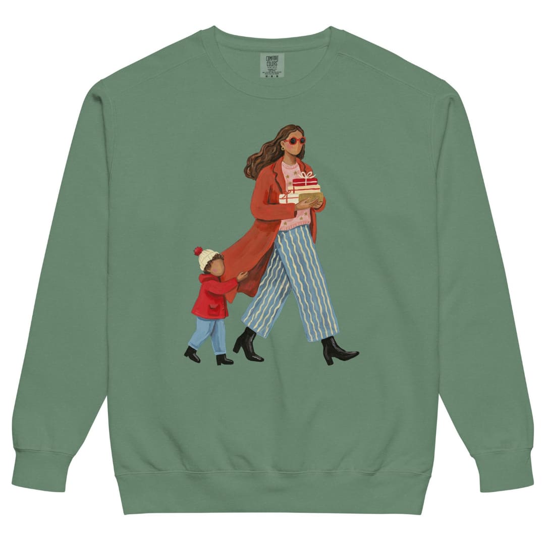 Wrapped & Running™ sweatshirt by Blossombless.co in Light Green, front view: a mom in a long red coat and red sunglasses carrying wrapped gifts, her toddler holding the hem of her coat, in a soft gouache style