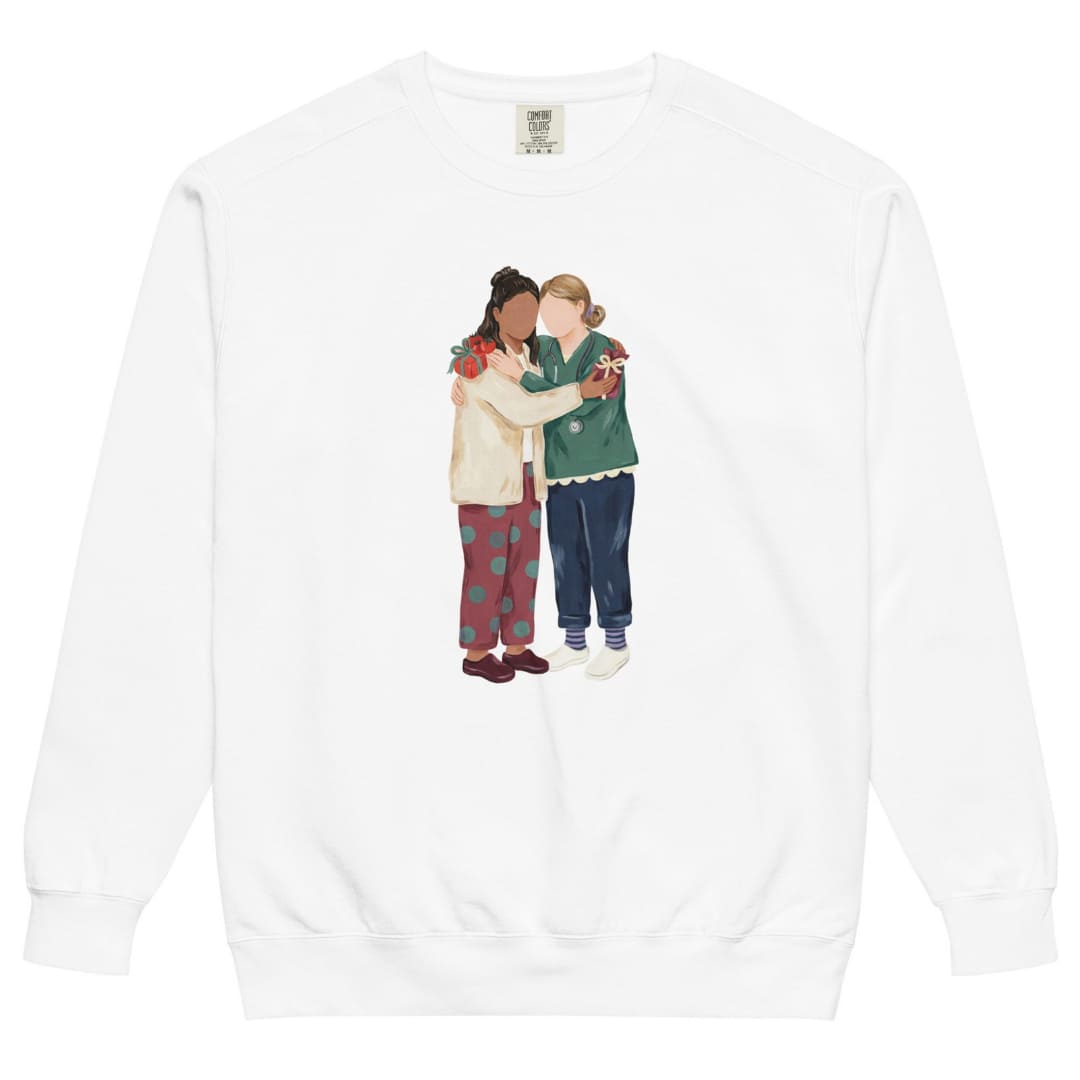 Charted With Love™ sweatshirt by Blossombless.co in White, front view: two nurse friends hugging, each hiding a wrapped gift, in a soft gouache style with a stethoscope, striped compression socks and clogs