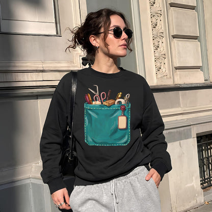 Woman wearing The Shift Pocket™ sweatshirt in Black on a city street, styled with gray sweatpants and sunglasses