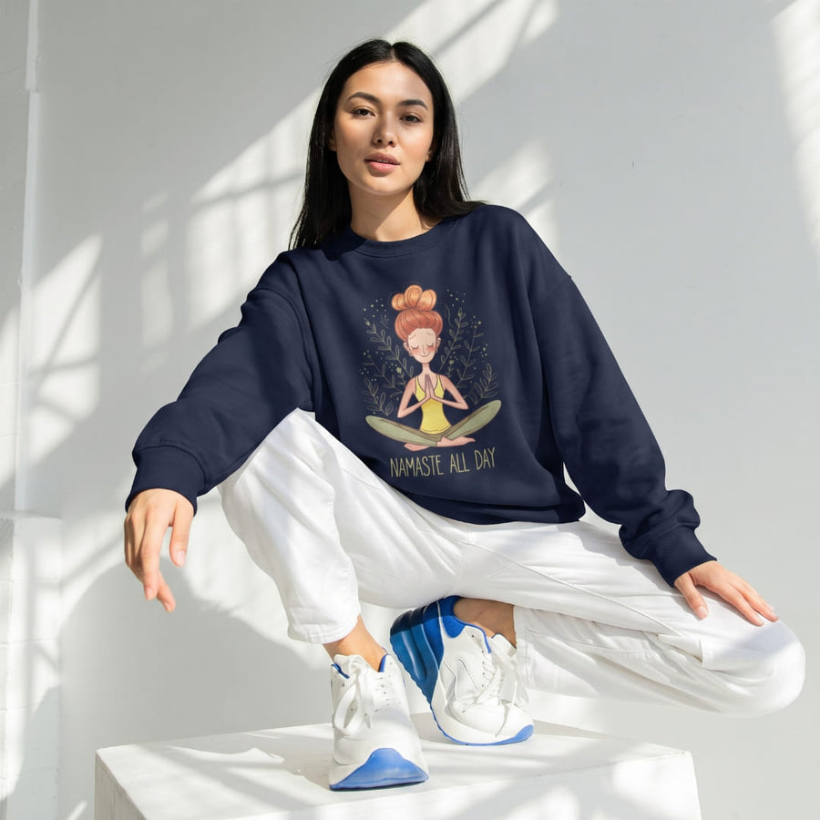 Namaste All Day™ oversized sweatshirt by Blossombless.co in Navy, lifestyle: woman in white trousers and sneakers seated in a bright studio