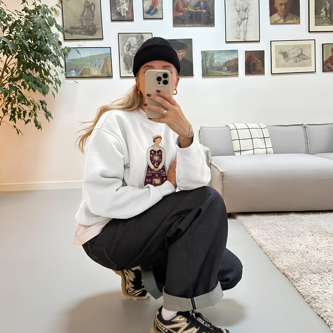 Mirror selfie in the Keeping Watch™ night shift nurse sweatshirt in White in a gallery-wall living room