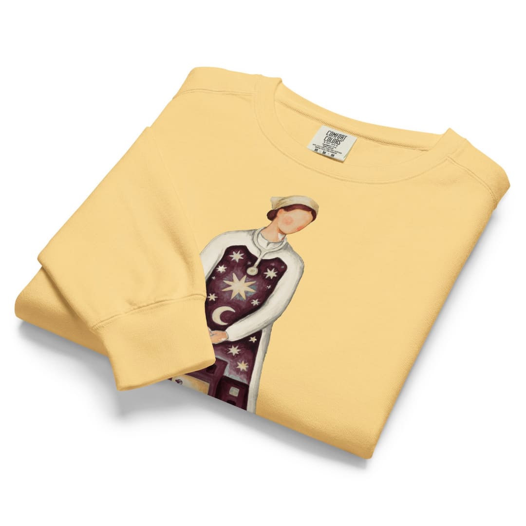 Keeping Watch™ night shift nurse Christmas sweatshirt in Butter, folded, garment-dyed Comfort Colors 1566 fleece
