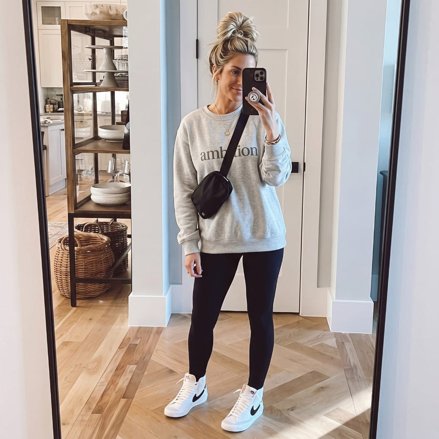 Ambition™ oversized sweatshirt by Blossombless.co in Athletic Heather, lifestyle: mirror selfie in a bright hallway with black leggings and a shoulder bag