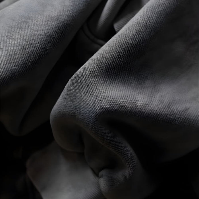 Close-up of folded Bella+Canvas 4711 fleece in deep charcoal black