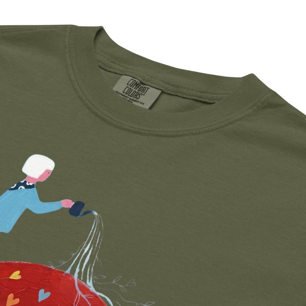 Hemp green t-shirt with a colorful graphic of a person watering a plant, featuring the 'Comfort Colors' brand.