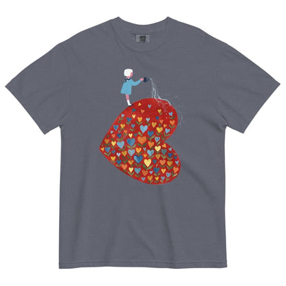 Denim blue t-shirt with a colorful heart design and a person holding a heart-shaped balloon on a white background