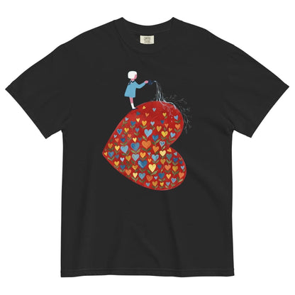 Black t-shirt with a colorful heart design and a small figure on a white background