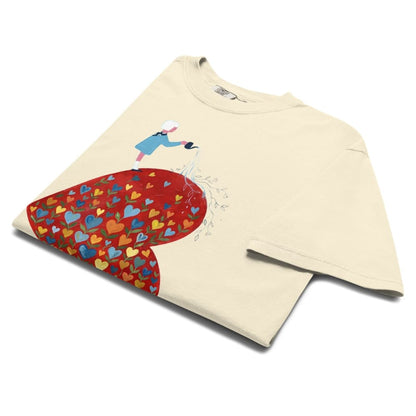 Ivory t-shirt with a colorful heart design and character on a white background