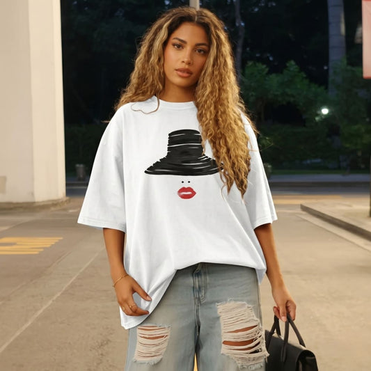 Woman wearing a white t-shirt with a graphic design outdoors