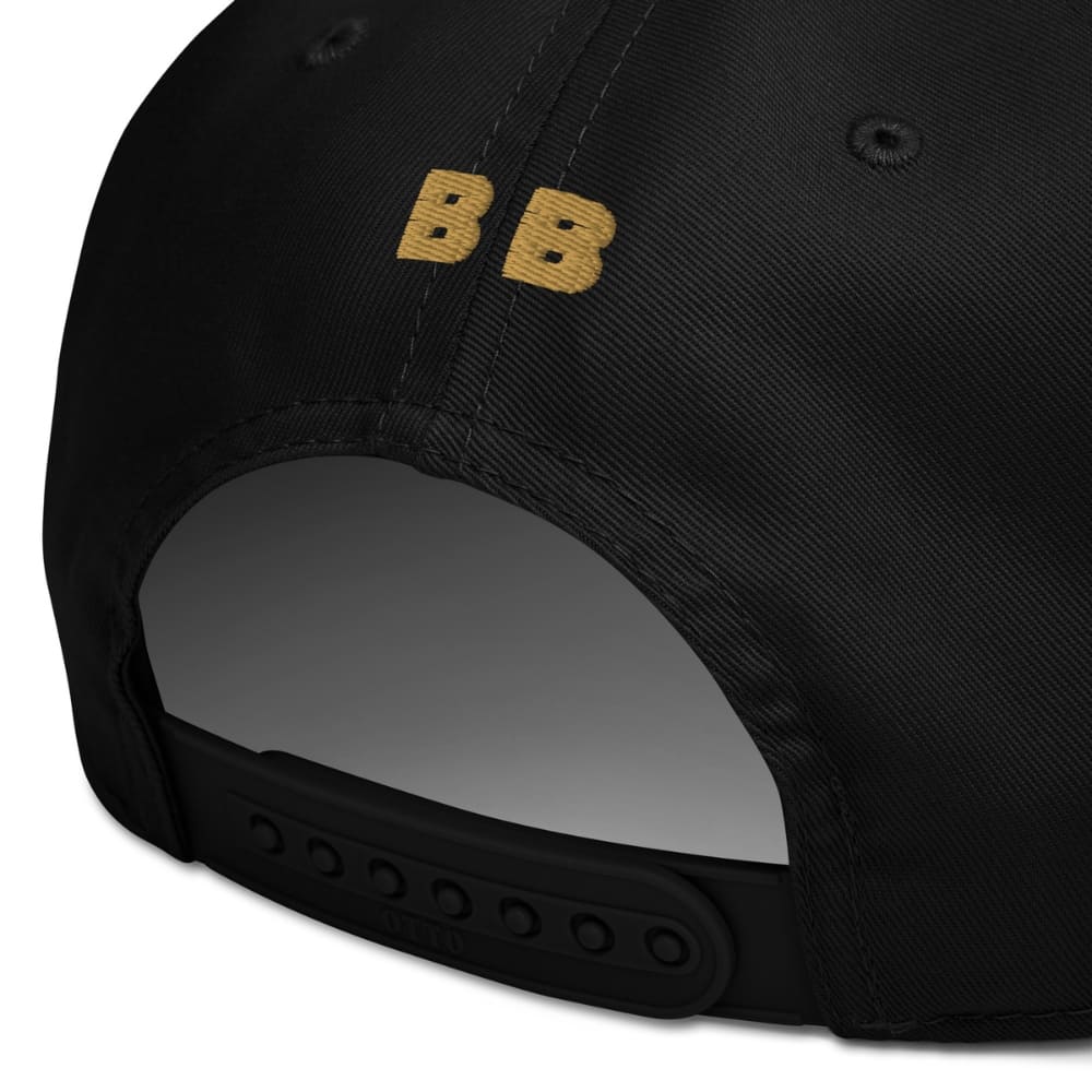 Black cap with 'LUXURY' embroidered on the back against a white background