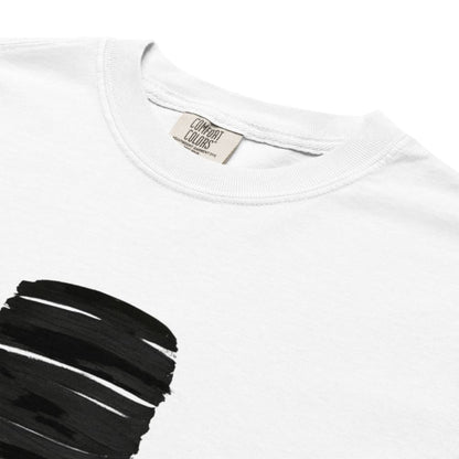 White t-shirt with black paint splashes on a white background