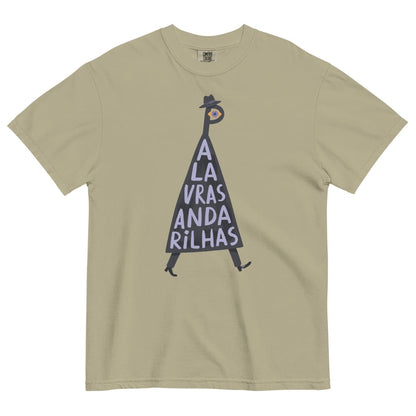 A beige short-sleeve crewneck t-shirt featuring a graphic illustration of a walking figure in a black hat and coat with the text 'A LA VRAS ANDA RILHAS' printed on the front.