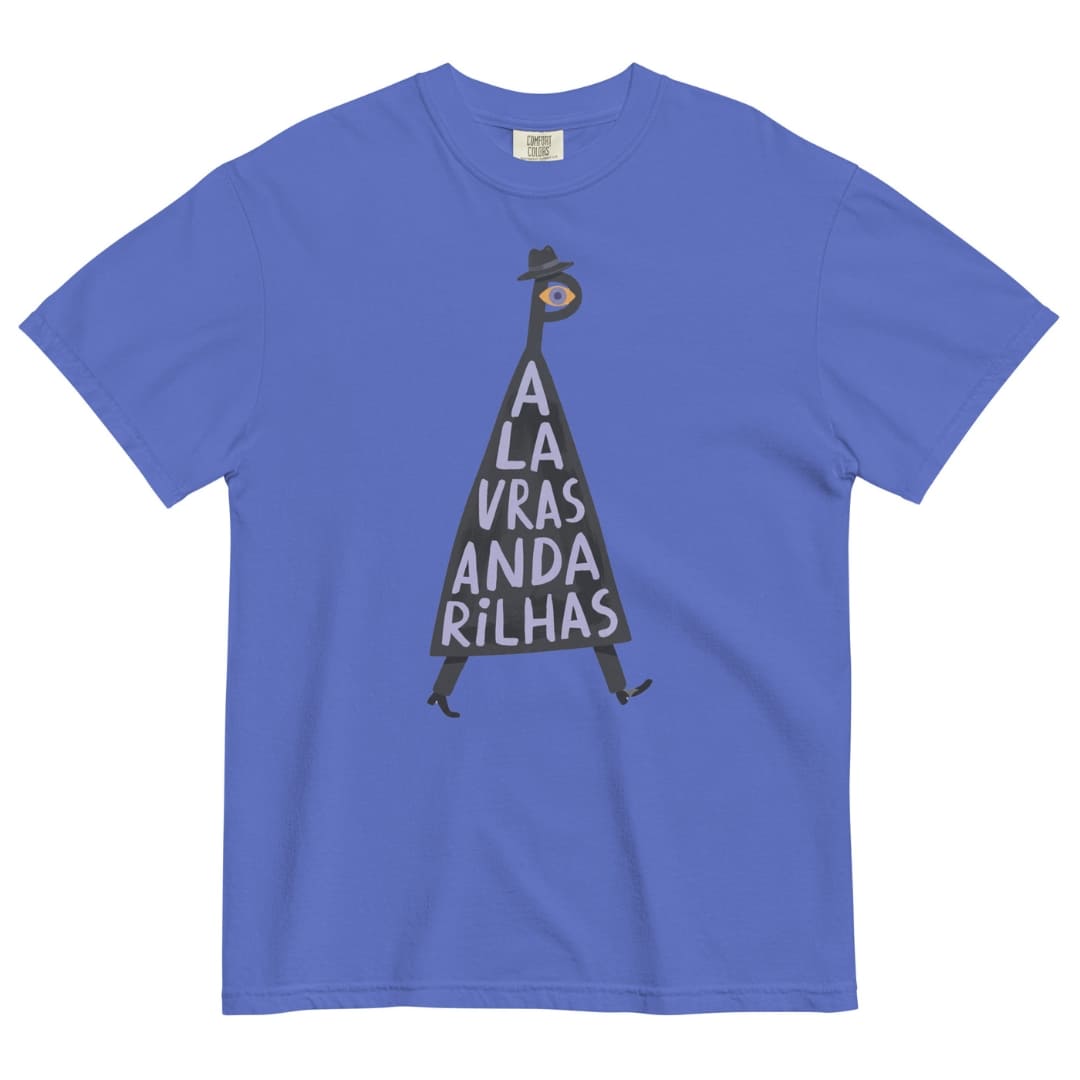 A royal blue short-sleeve crewneck t-shirt featuring a graphic illustration of a dark gray pyramid with the white text 'A LA VRAS ANDA RILHAS' and a small figure inside wearing a hat and sunglasses.