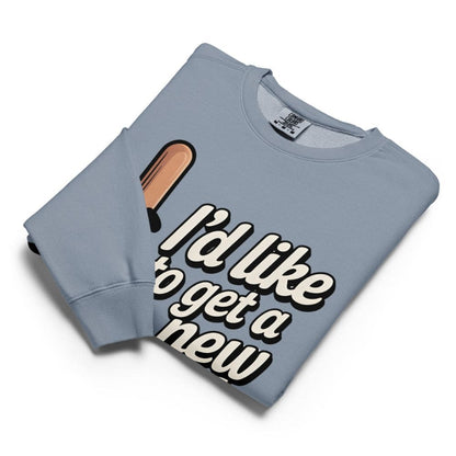 Folded light blue sweatshirt with text and ice cream graphic on a white background