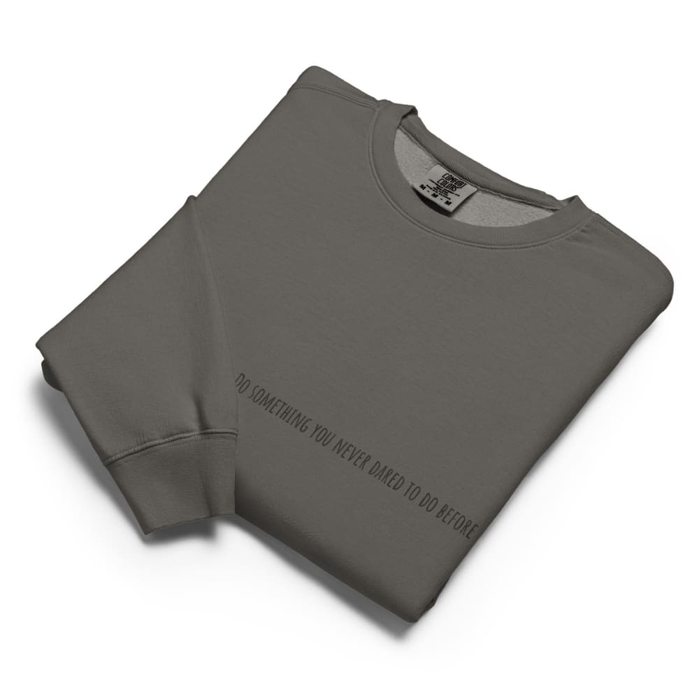 Folded gray sweatshirt with text on a white background