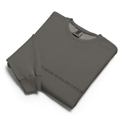 Folded gray sweatshirt with text on a white background