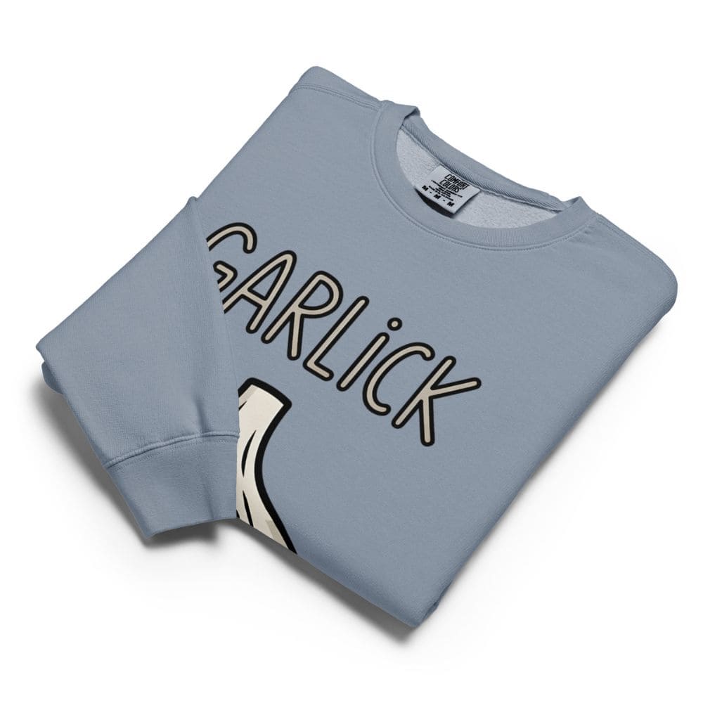 Folded light blue sweatshirt with 'GARLICK' text on a white background