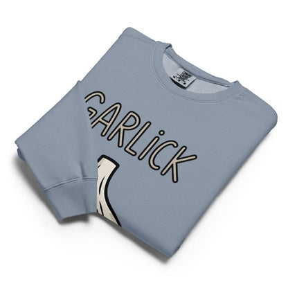 Folded light blue sweatshirt with 'GARLICK' text on a white background