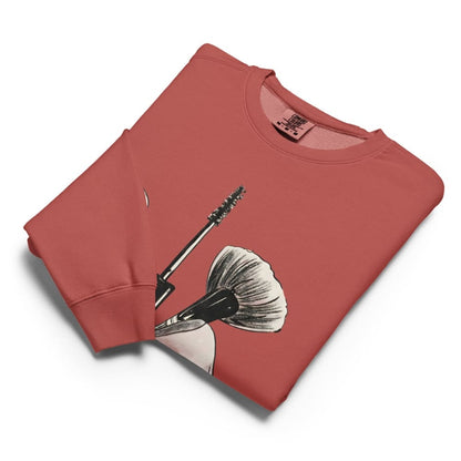 Folded red sweatshirt with a graphic design on a white background