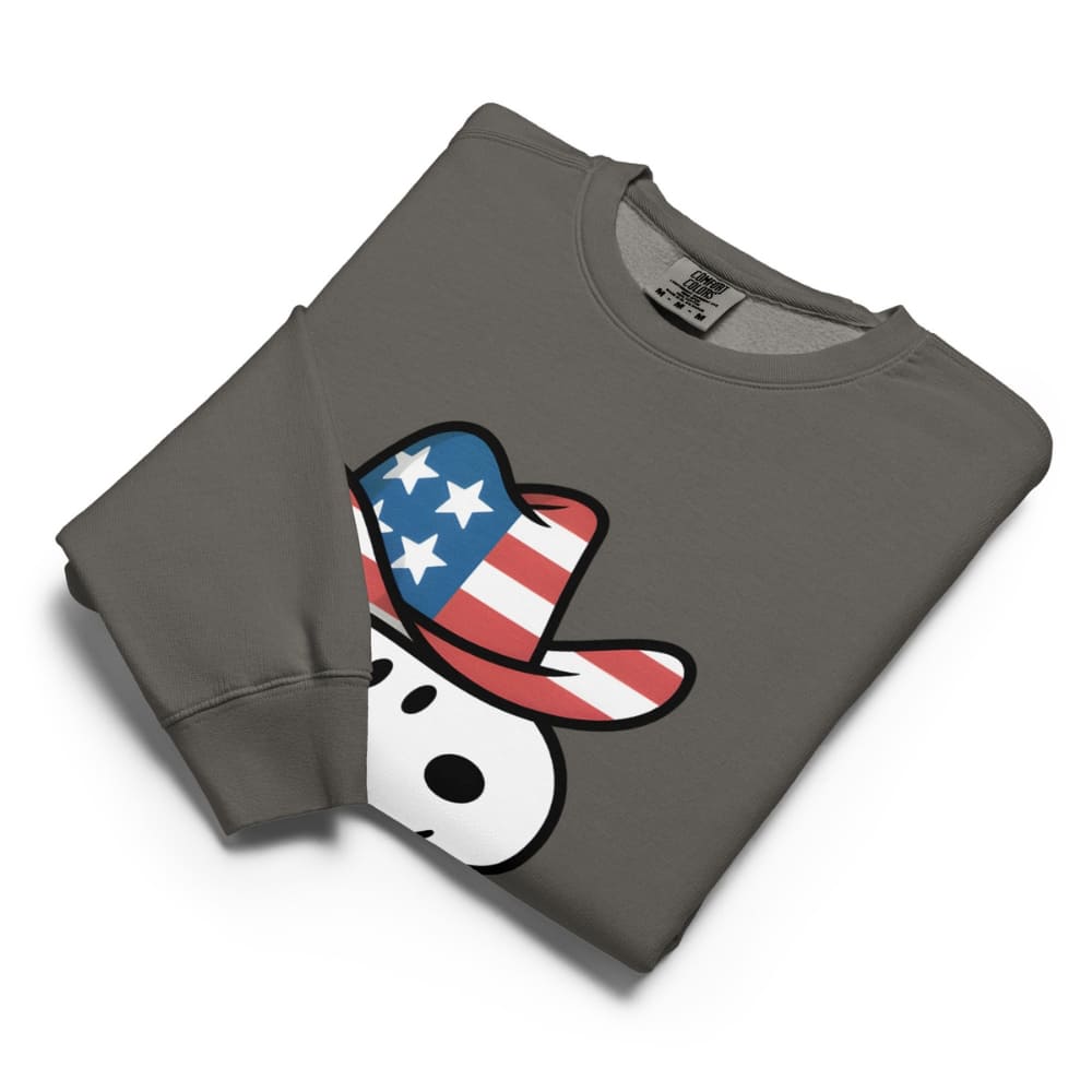 Folded gray sweatshirt with a graphic of a snowman wearing an American flag hat on a white background