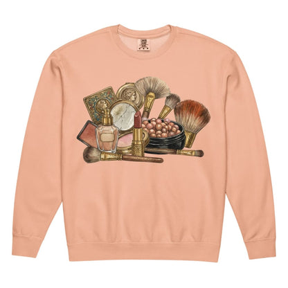 Peach sweatshirt with vintage makeup brush and product illustration on a white background