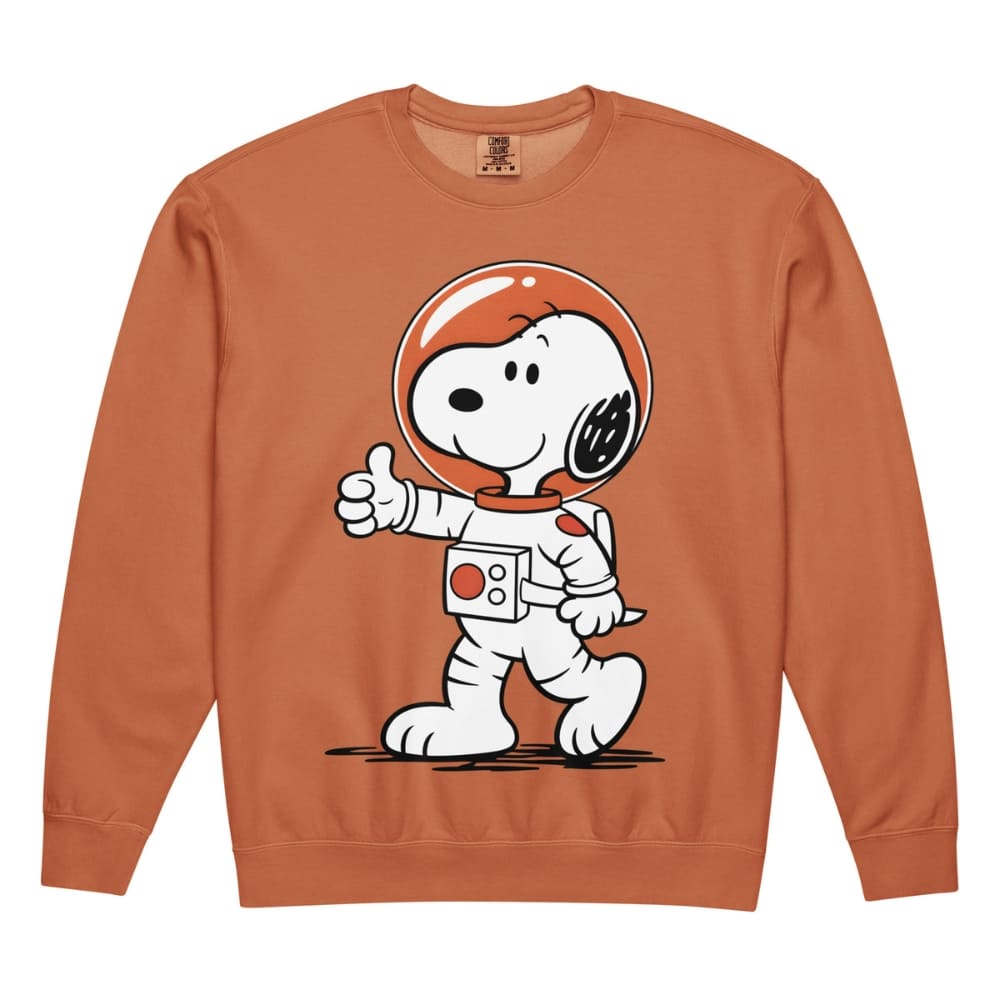 Snoopy in an astronaut suit on a orange sweatshirt with a white background