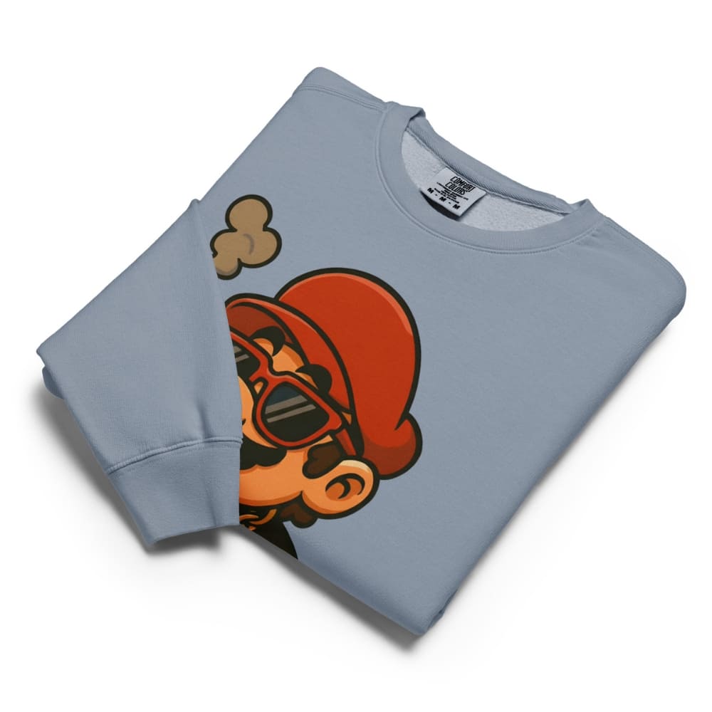 Folded light blue sweatshirt with a graphic design on a white background