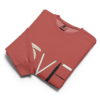 Folded red sweatshirt with white graphic design on a white background