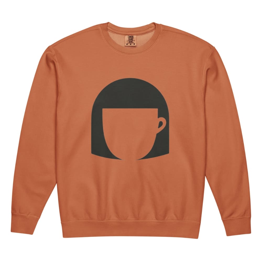 Orange sweatshirt with a black graphic of a face on a white background