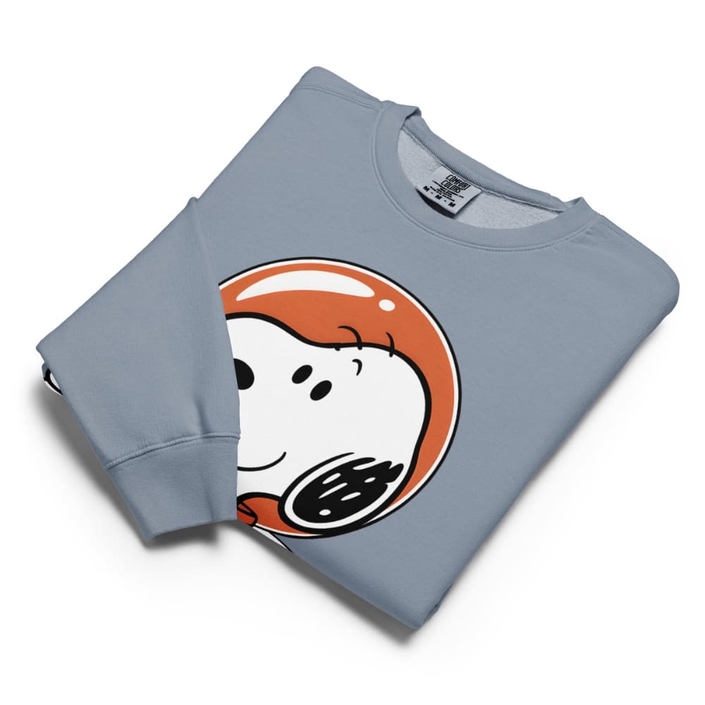 Folded blue sweatshirt with cartoon character design on a white background