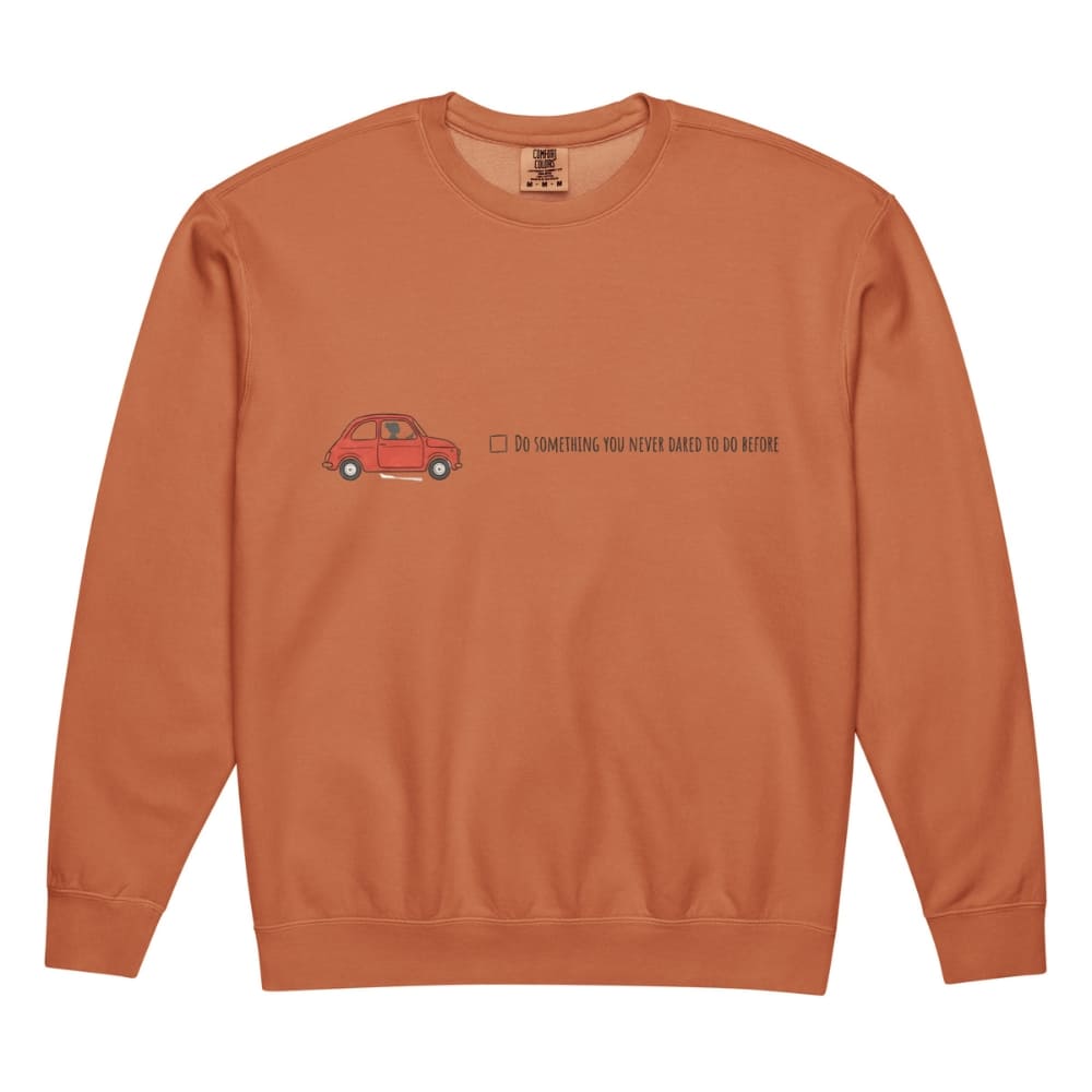Orange sweatshirt with a red car graphic and text on a white background