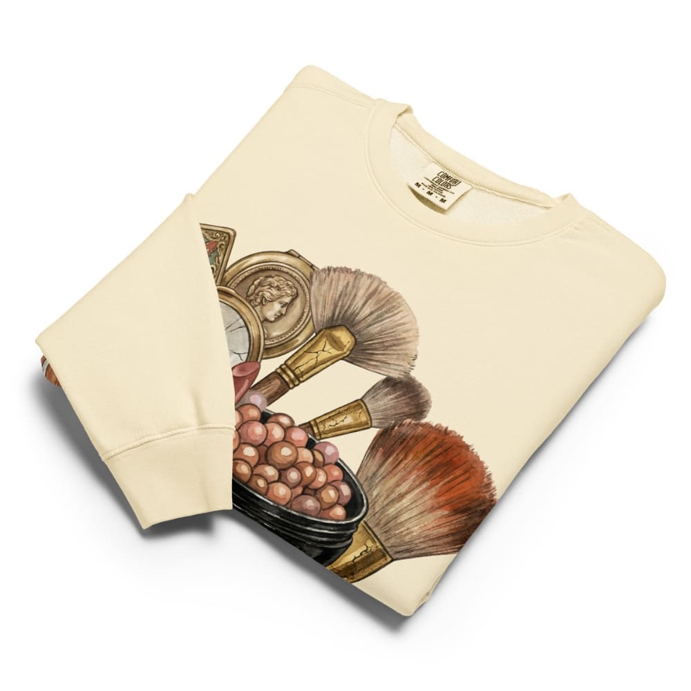 Ivory sweatshirt with vintage makeup brush design on a white background