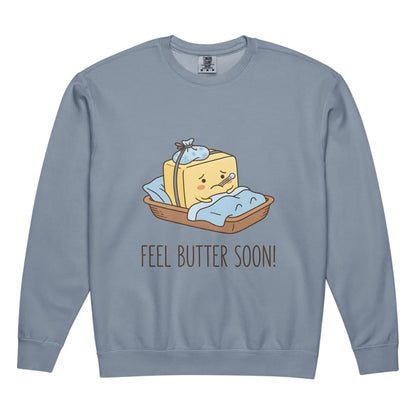 Blue sweatshirt with a cartoon illustration of a slice of bread with butter and text 'FEEL BUTTER SOON!' on a white background.