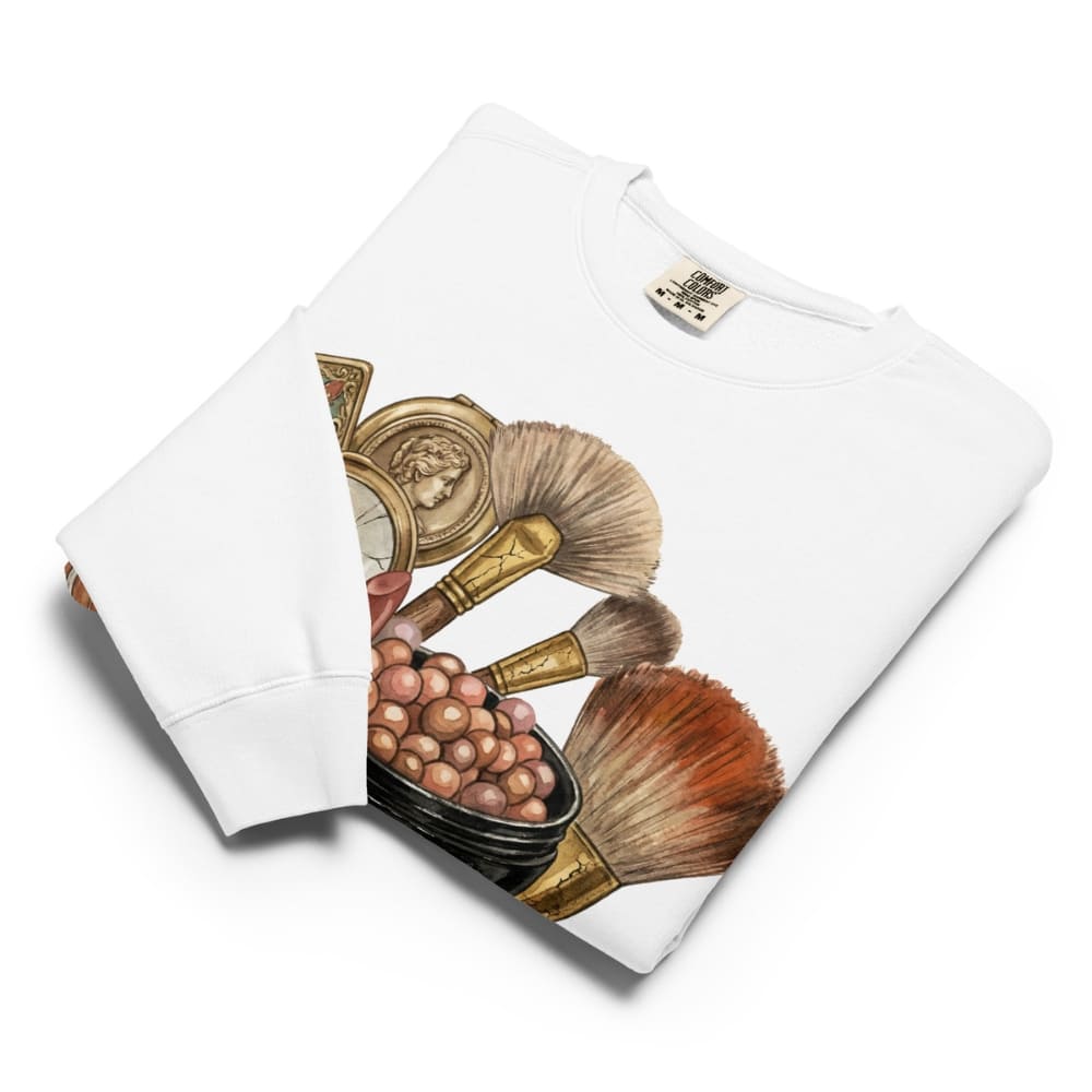 Folded White sweatshirt, Makeup brush set on a white background