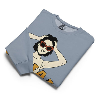 Folded light blue sweatshirt with a graphic design on a white background