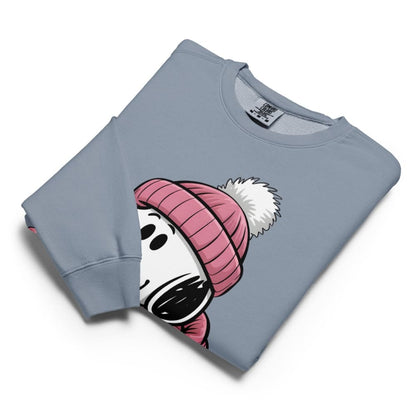 Folded blue sweatshirt with cartoon character wearing a pink beanie on a white background