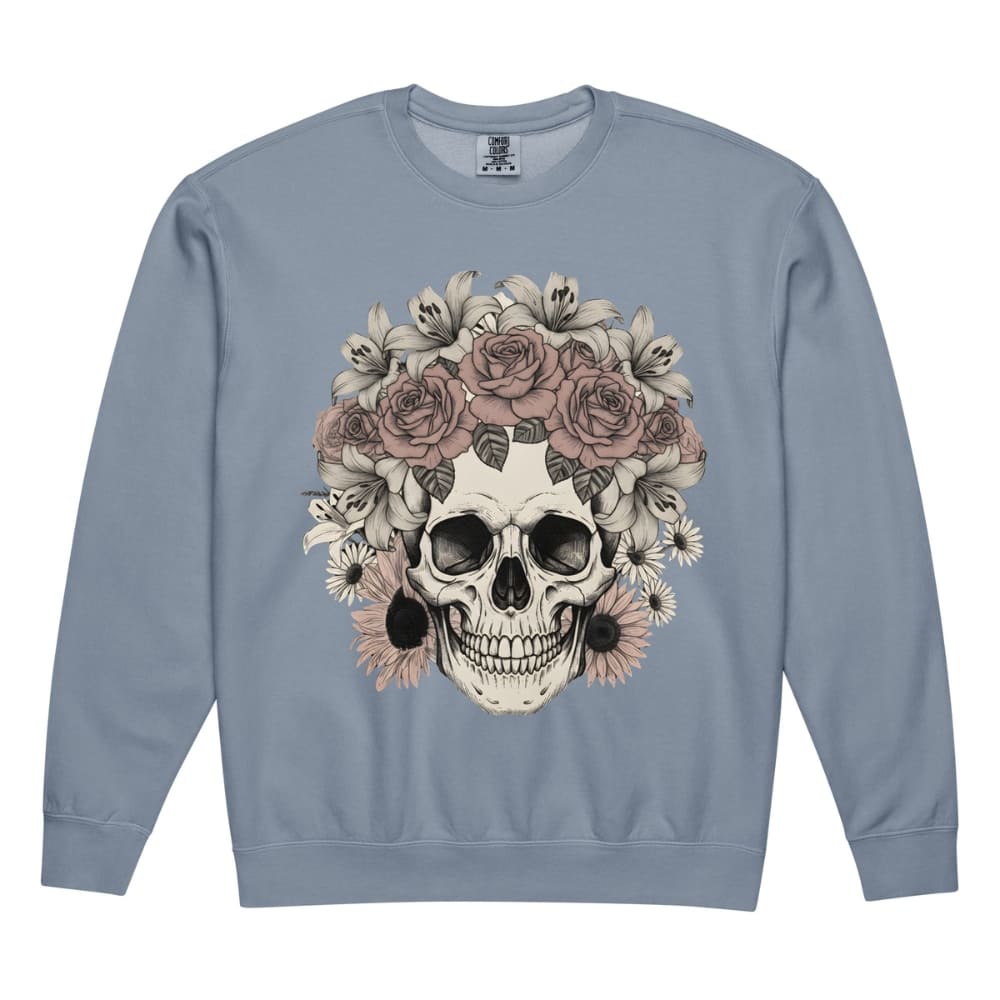 Blue sweatshirt with a skull and floral design on a white background