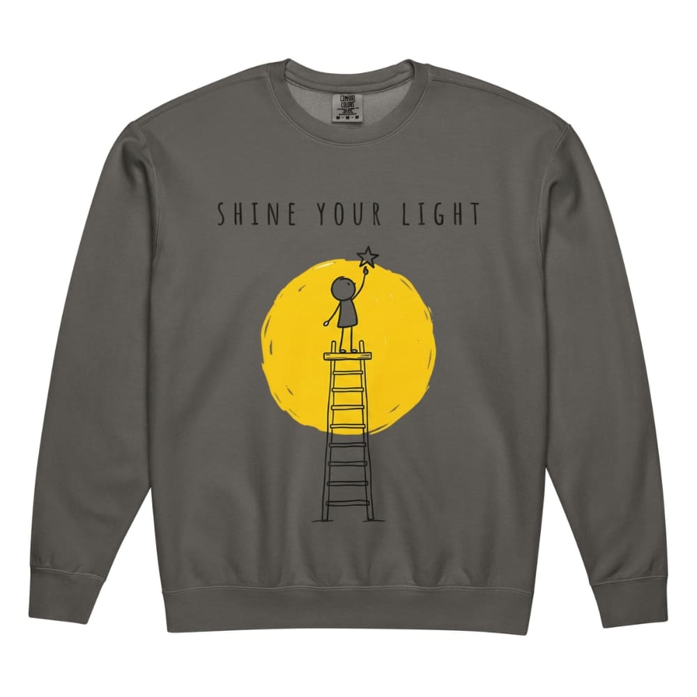 Gray sweatshirt with 'Shine Your Light' graphic design on a white background