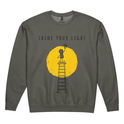 Gray sweatshirt with 'Shine Your Light' graphic design on a white background