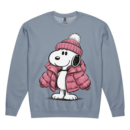 Snoopy wearing a pink winter coat and hat on a blue sweatshirt