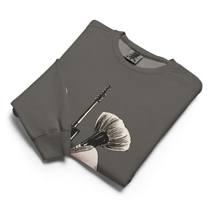 Folded gray sweatshirt with a graphic design on a white background