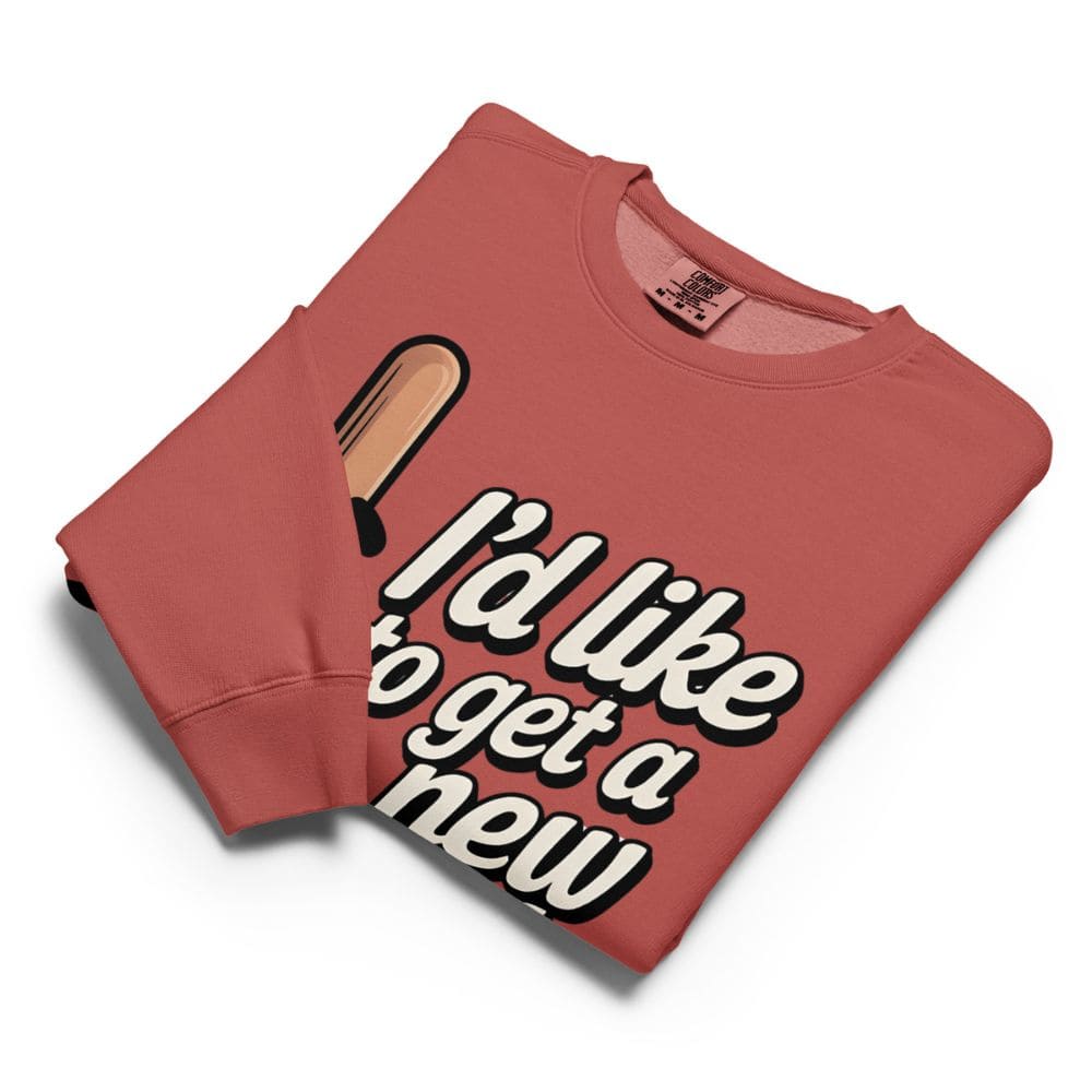 Folded red sweatshirt with text and graphic on a white background