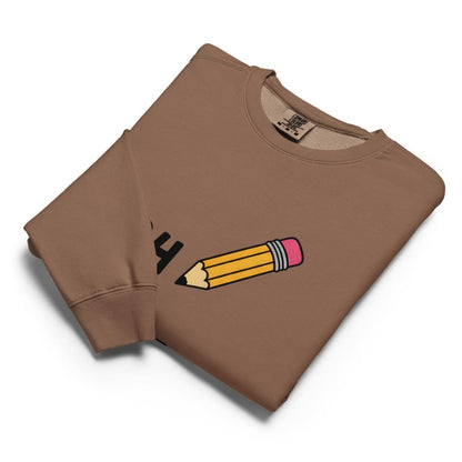 Brown sweatshirt with a pencil and eraser graphic on a white background