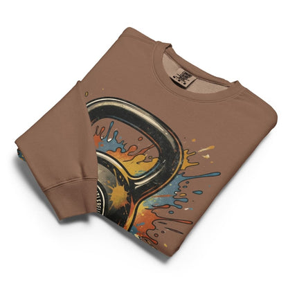 Folded brown sweatshirt with colorful graphic design on a white background