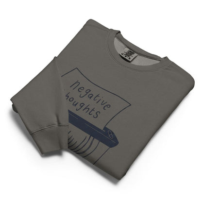 Folded gray sweatshirt with graphic design on a white background