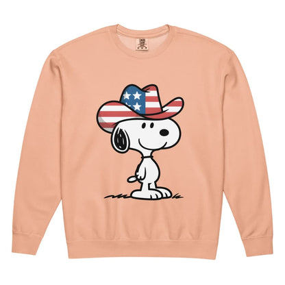 Peach sweatshirt with a cartoon dog wearing an American flag cowboy hat on a white background