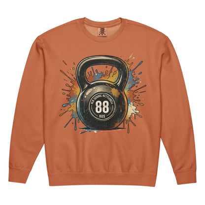 Orange sweatshirt with a kettlebell graphic on a white background
