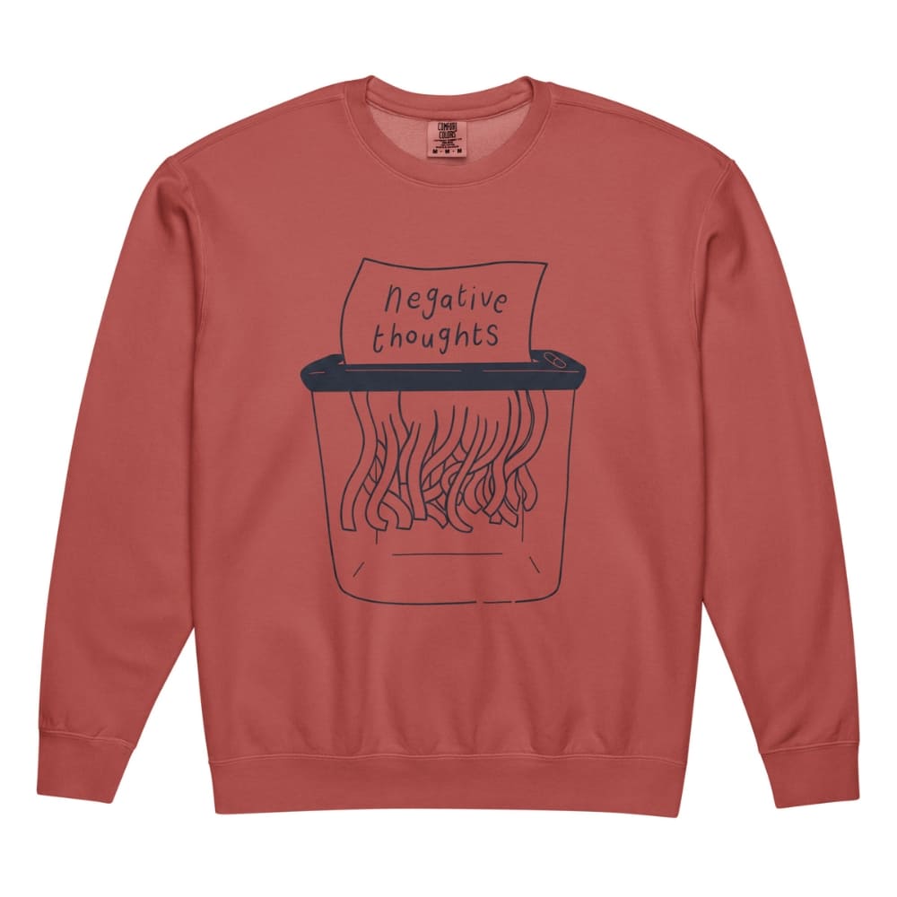 Terracotta-colored  sweatshirt with a graphic of a shredder and 'negative thoughts' text on a white background