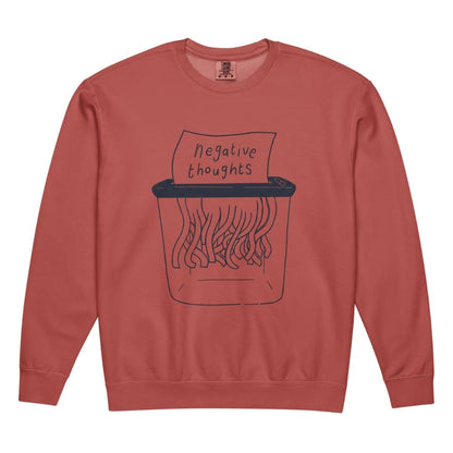 Terracotta-colored  sweatshirt with a graphic of a shredder and 'negative thoughts' text on a white background