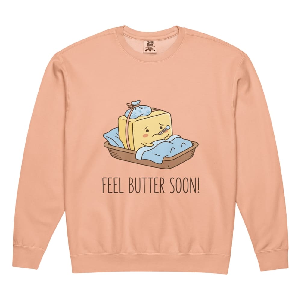 Peach-colored sweatshirt with a cartoon design of butter and text 'FEEL BUTTER SOON!' on a white background